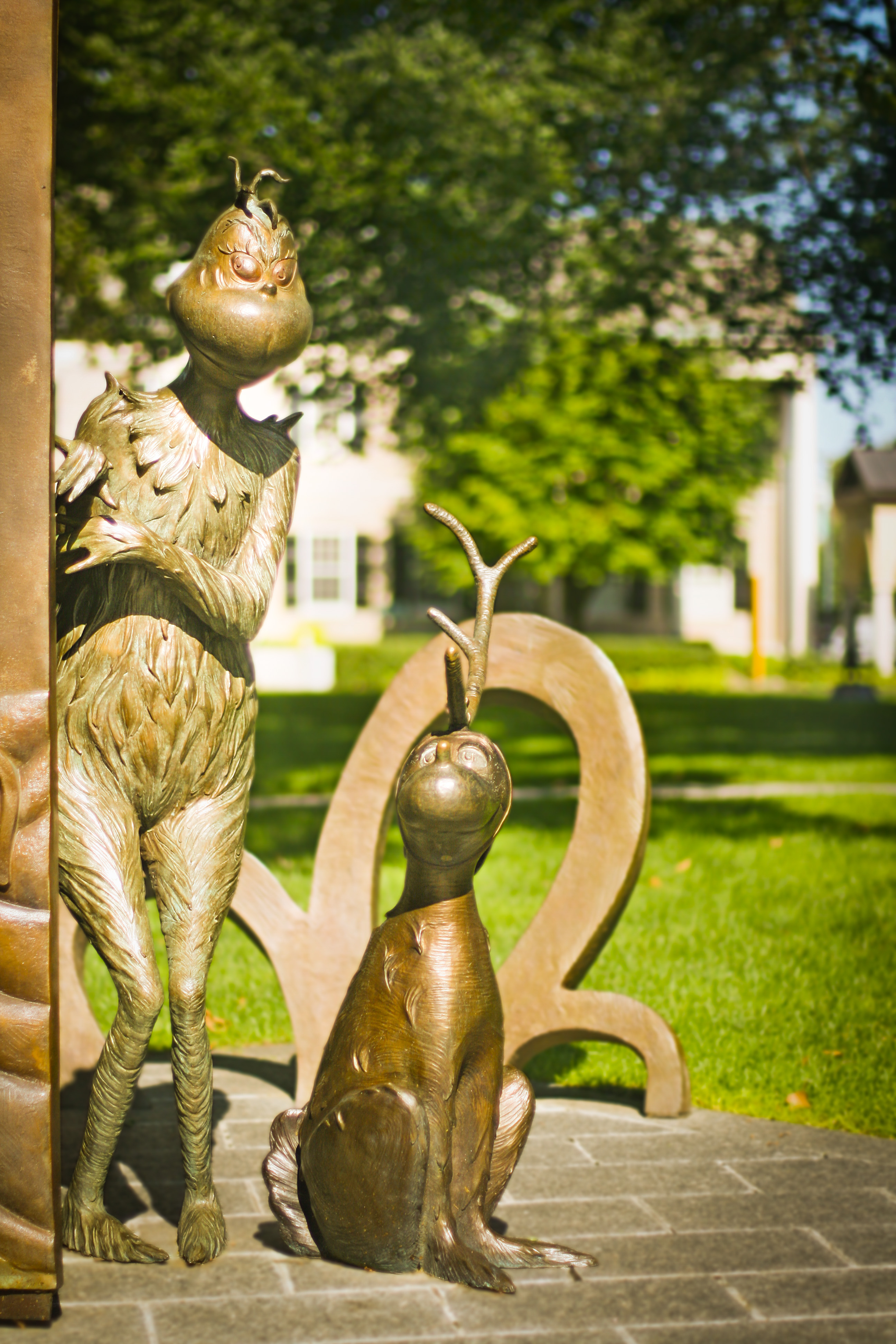 Bronze sculptures of the Dr. Seuss Characters Grinch and Max from the book "How the Grinch Stole Christmas".