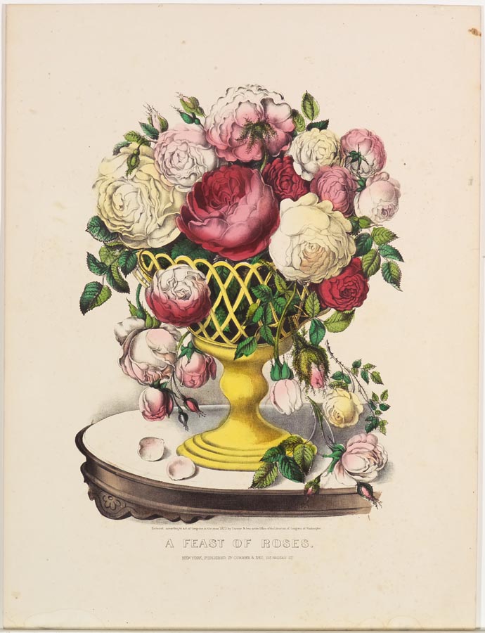 Yellow vase full of roses (full and buds) on table top