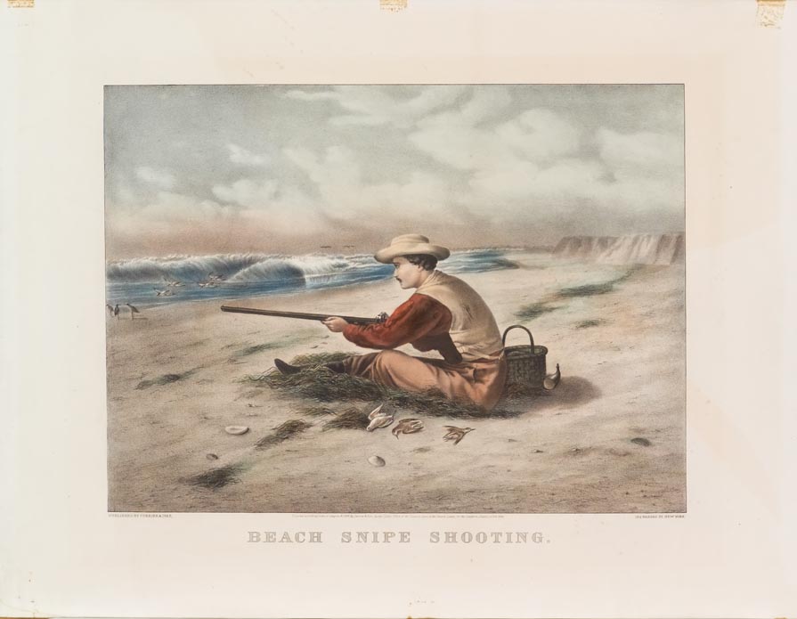 Scene of a man sitting in sand on beach