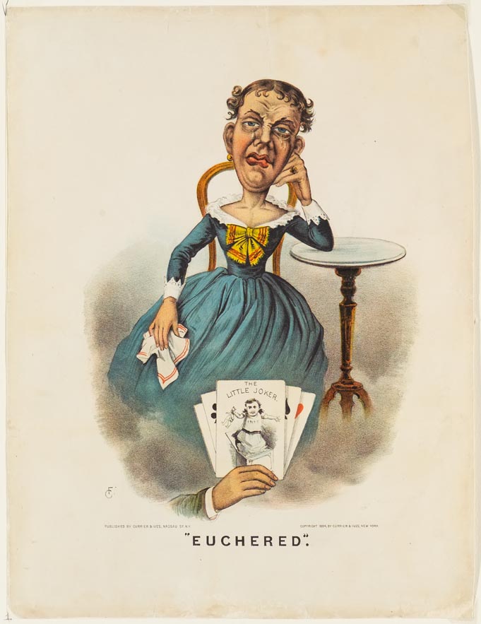 Man dressed in blue dress sitting in chair next to a table