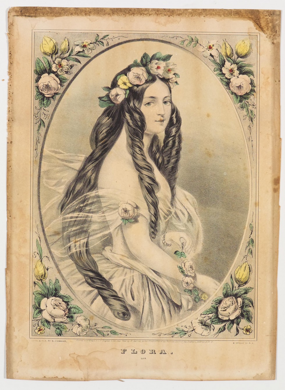 In oval image of woman with hip length hair and crown of flowers facing toward right