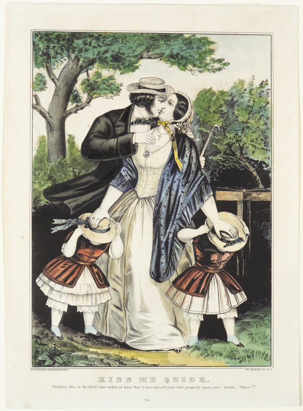 Couple (man to left) kissing with two daughters aside woman's skirts