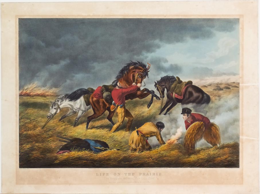 Trapper at center reigning in his horse