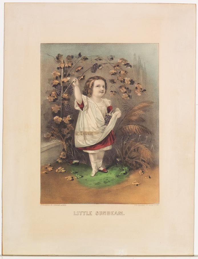 Little girl standing at center under bough of bunches of grapes and leaves
