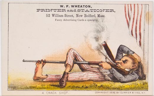Man lying on grass smoking a cigar with rifle in hand extending down through toes of his left foot