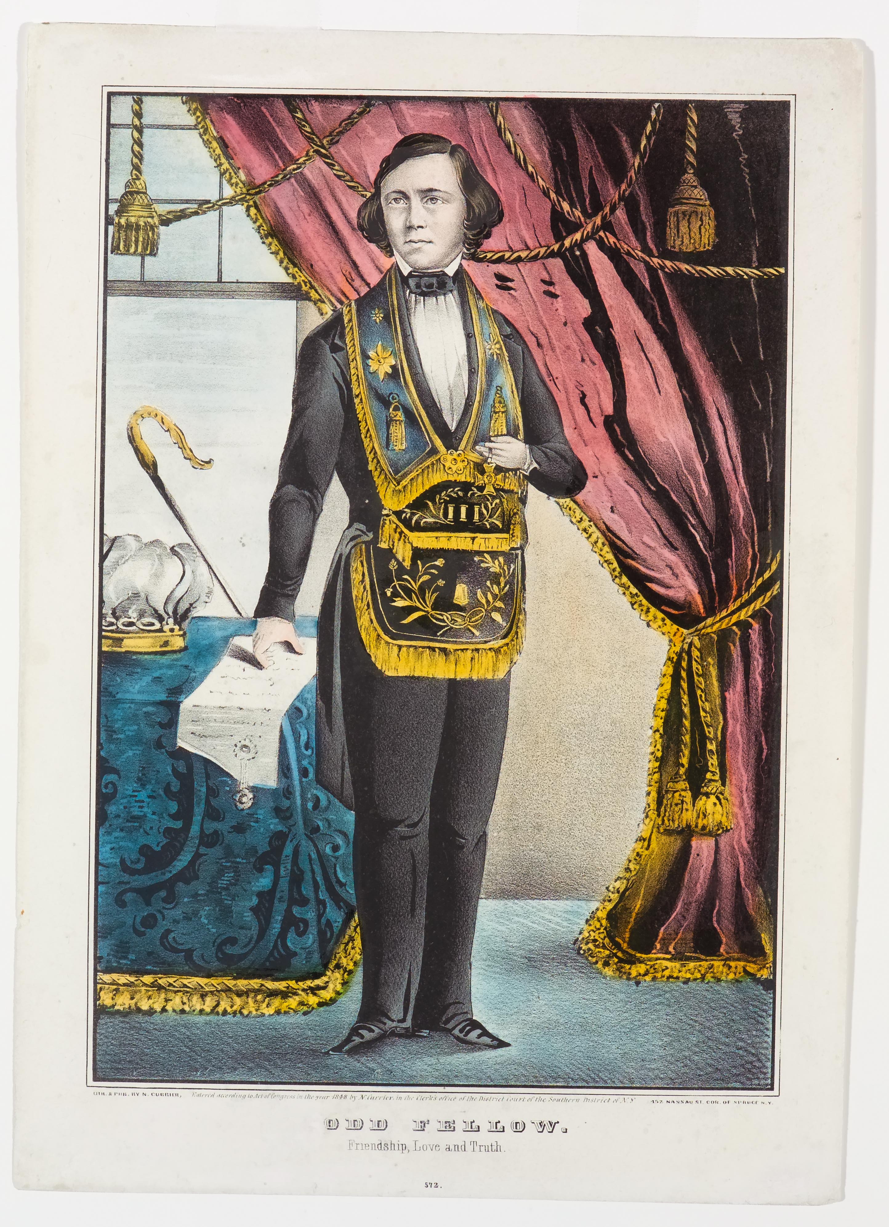 Man with suit over which he's wearing a decorative apron