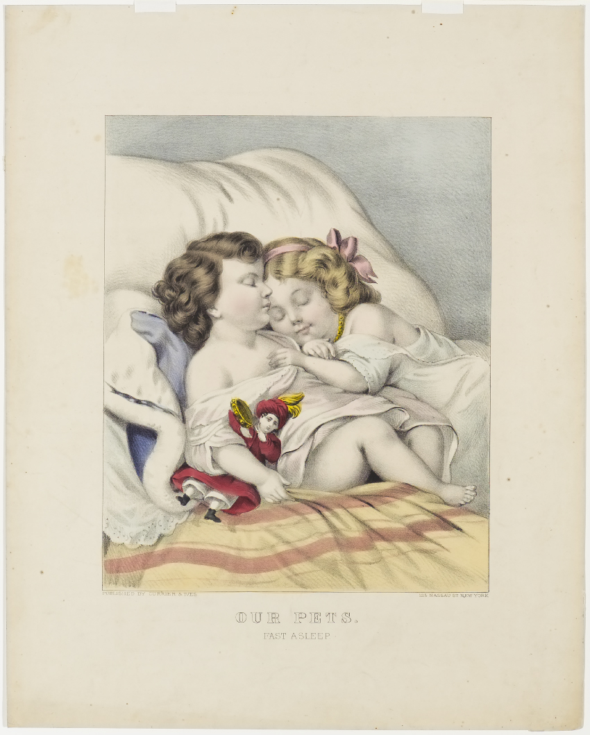 Two children asleep against pillows atop striped blanket
