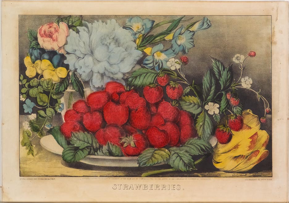 Dish of strawberries at center with flowers in vase behind at left
