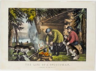 Two men sitting outside log cabin cooking on campfire