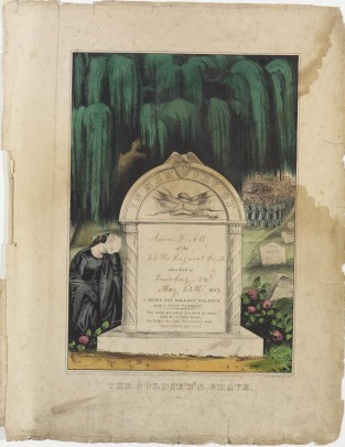 Woman seated to left of stone