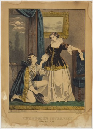 Man at left kneeling beside woman holding her proper right hand in his left