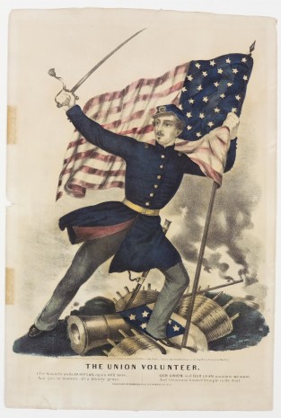 Soldier facing left in center - holding unfurling American flag in proper left hand