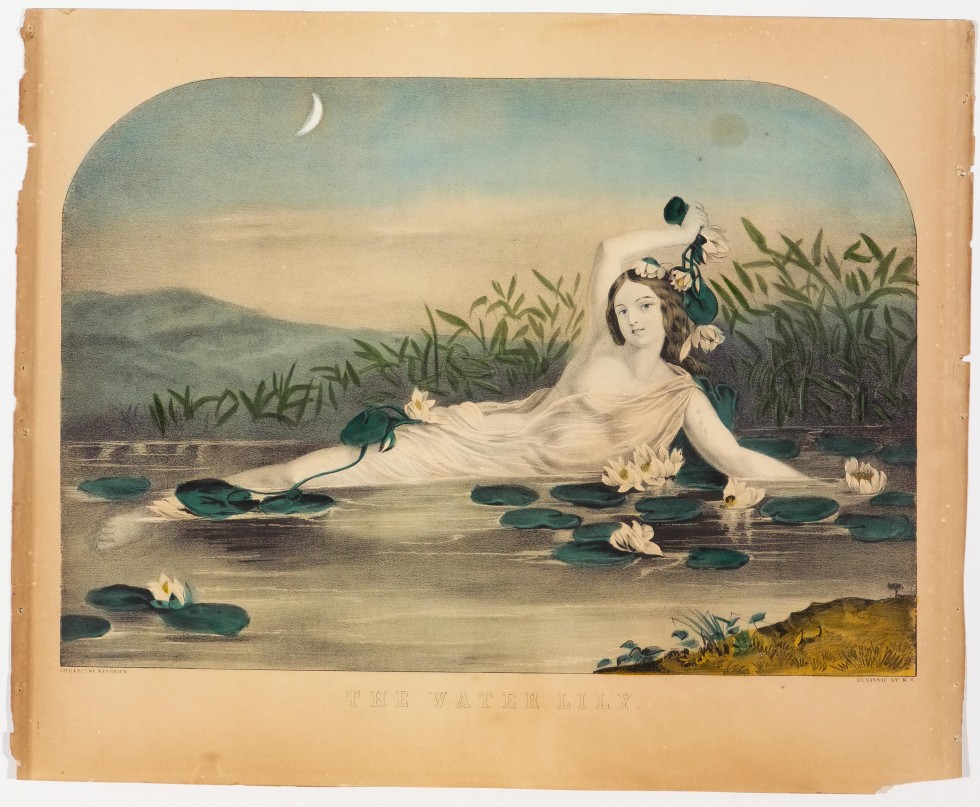 Woman reclining in water amidst lily pads