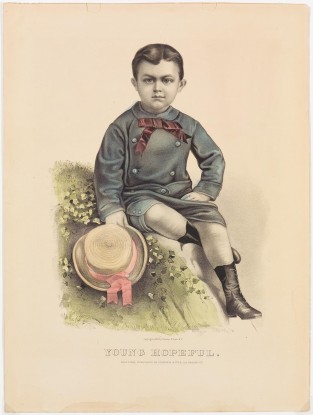 Young boy sitting on a knoll dressed in blue suit with pink tie