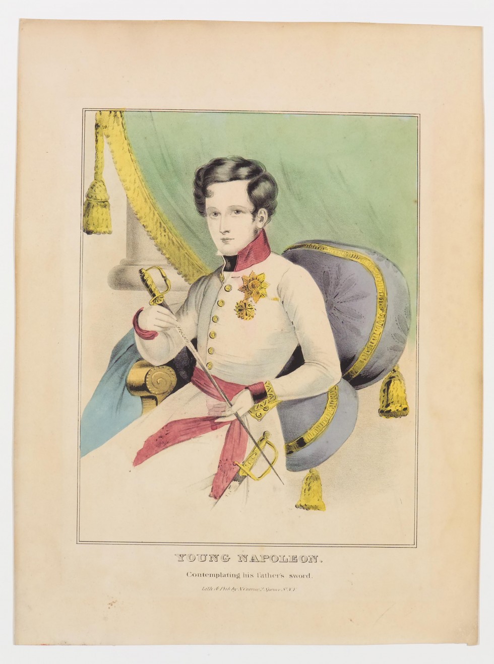 Young soldier seated on grey cushion looking forward