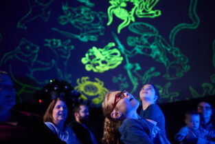 Kids watching a planetarium show