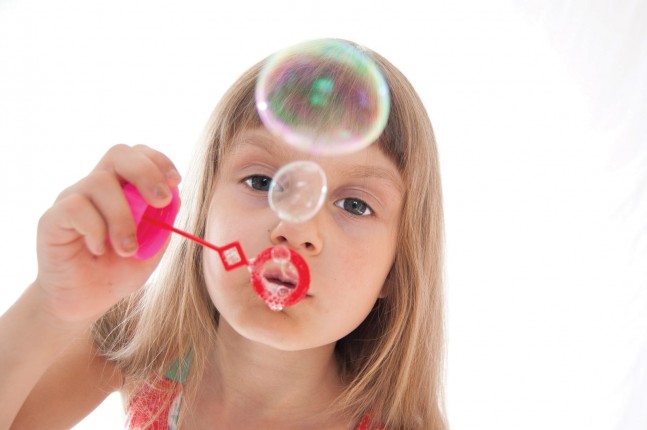Girl blowing bubbles
