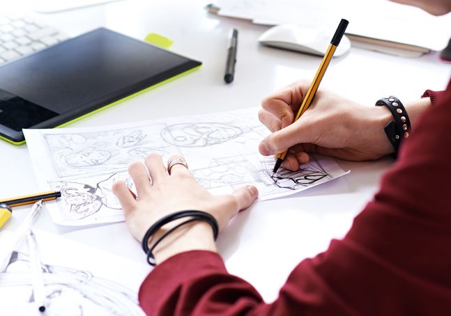 Young artist creating comic book