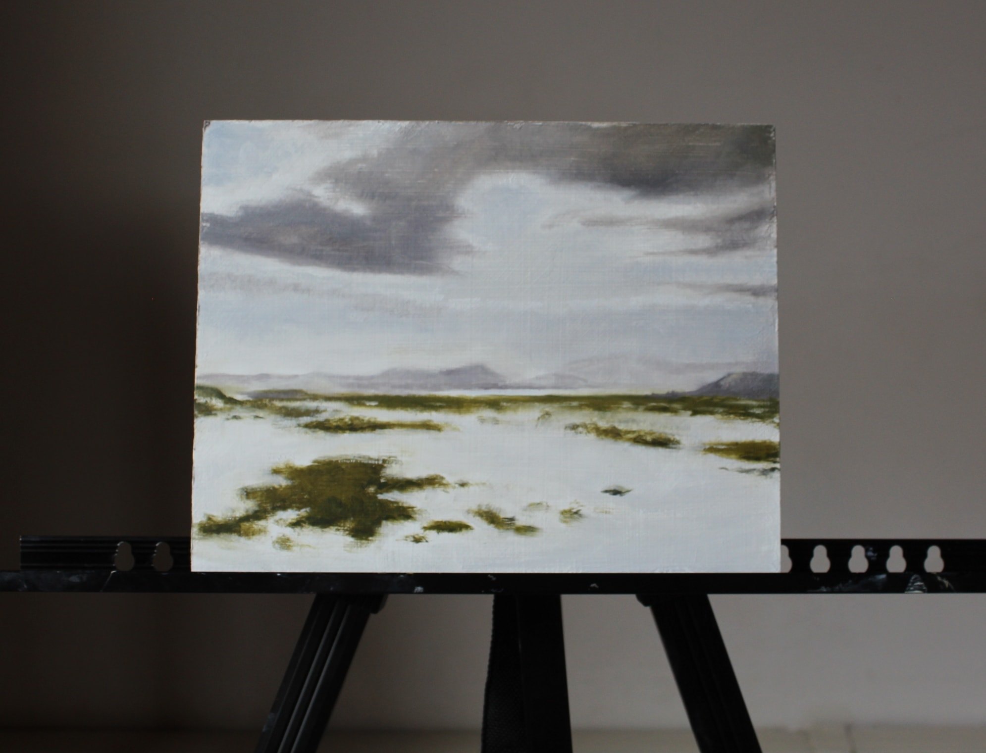 Winter landscape painting on an easel