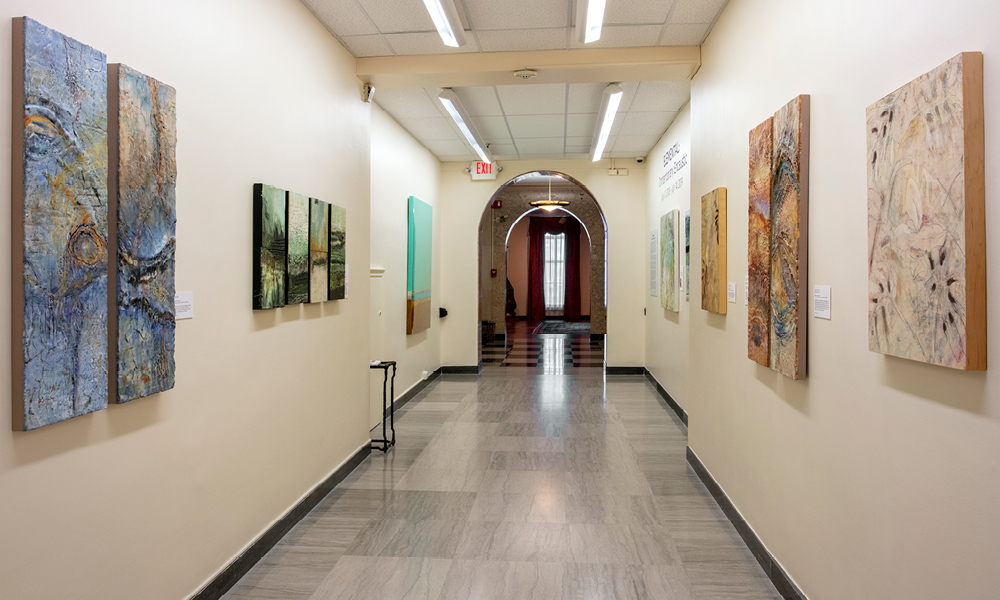 Long hallway with paintings