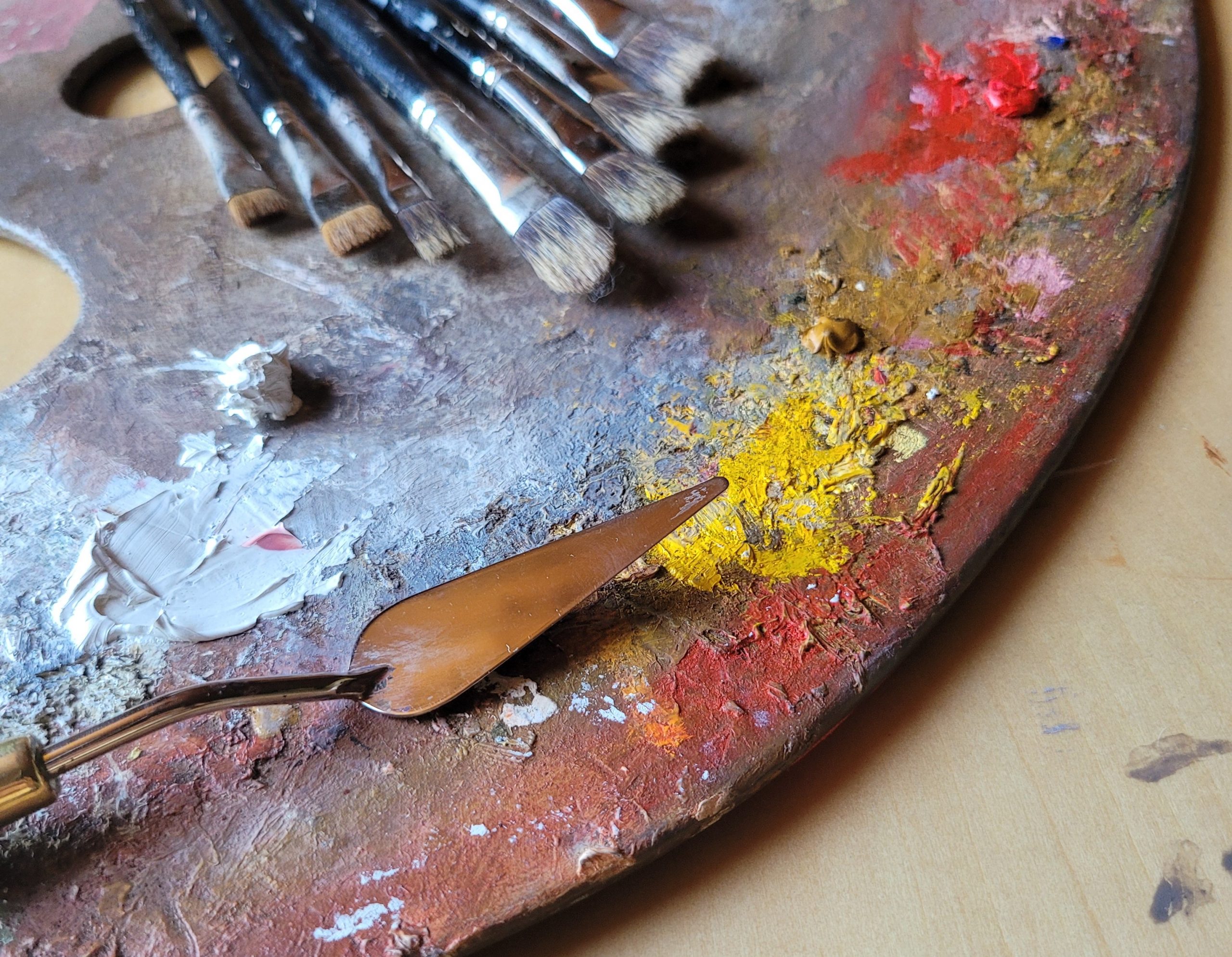 Paints and brushes on a palette