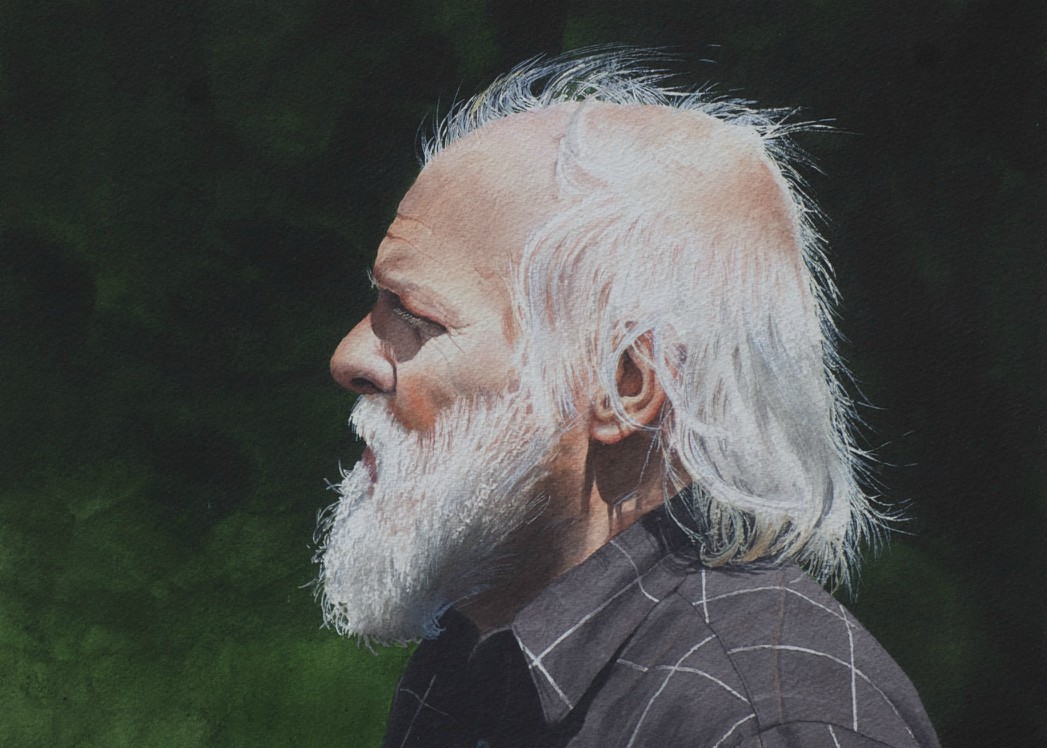 Profile portrait of a man with a white beard