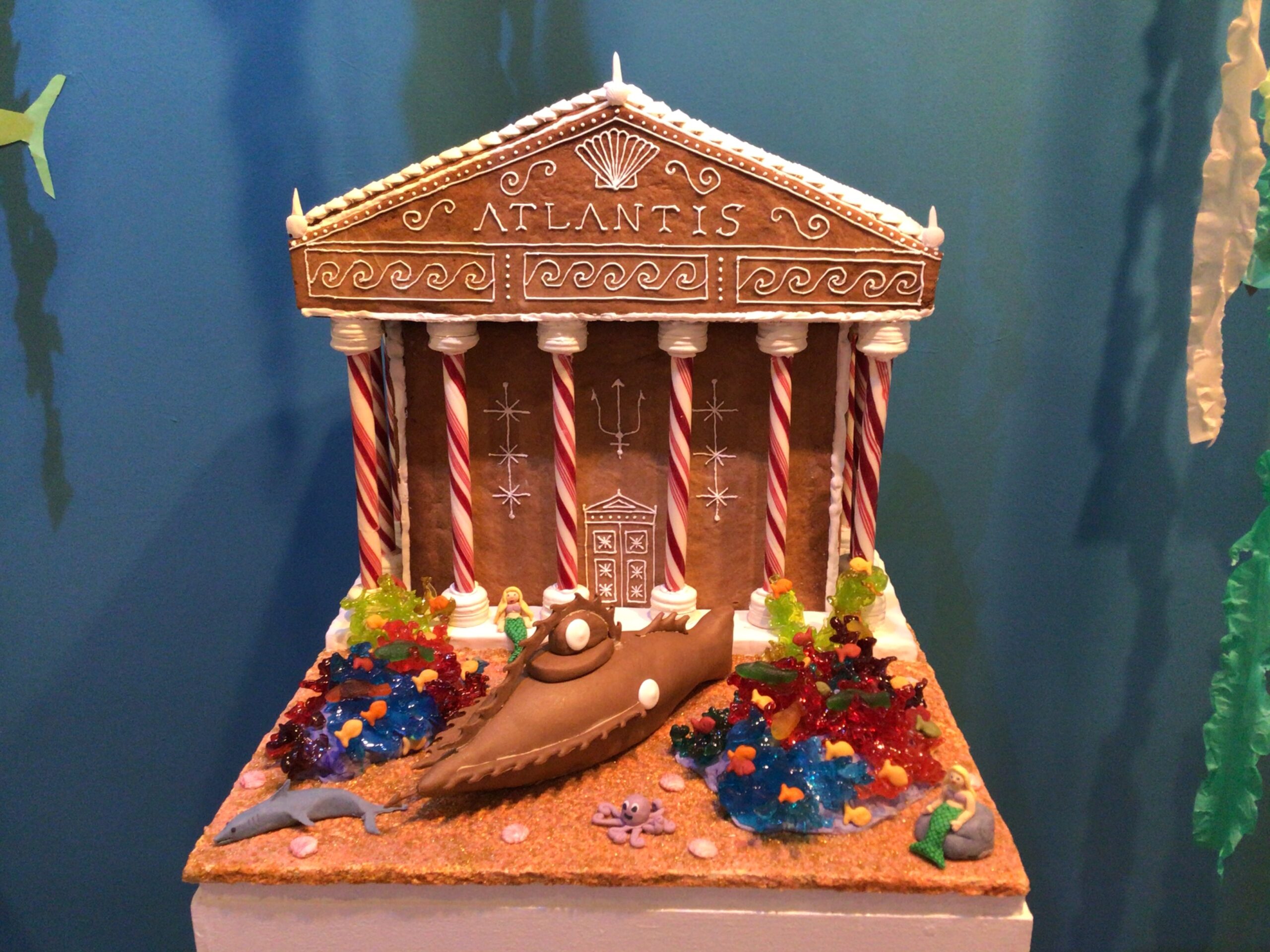 Gingerbread model of greek building with candy cane columns