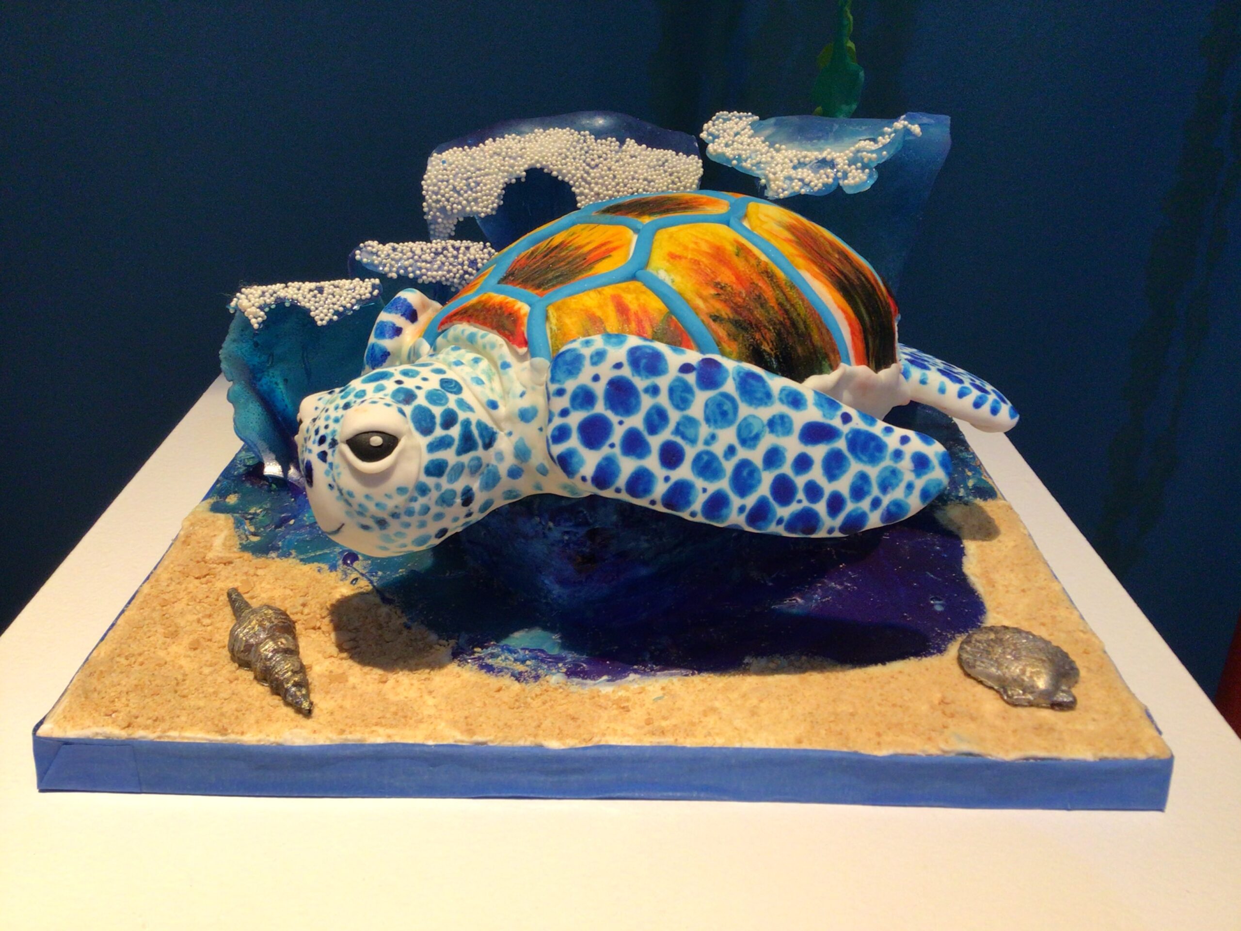 fondant sea turtle in bright blues and oranges