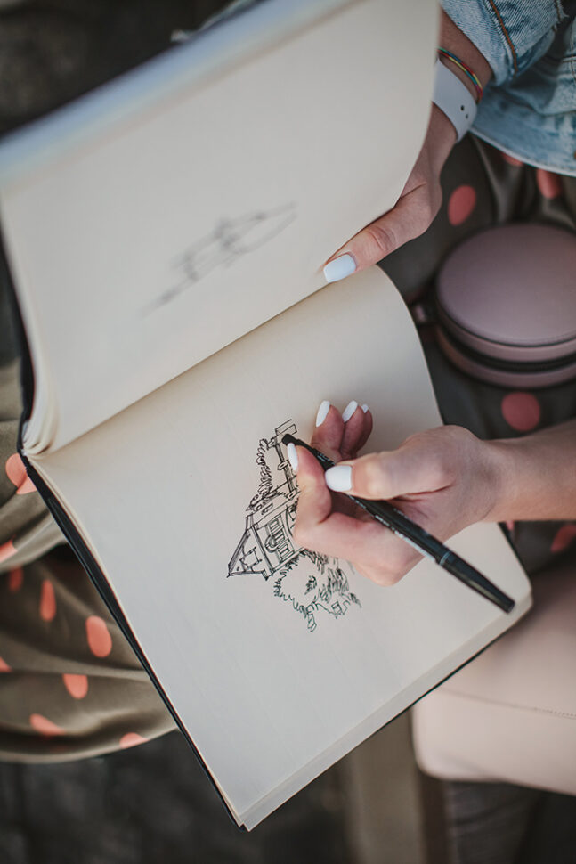 Sketchbook with a drawing of a house close-up