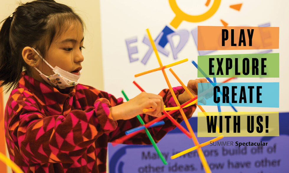 Girl building a structure from colorful plastic sticks