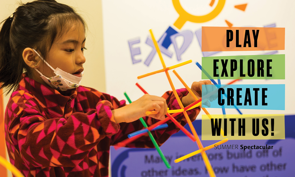 Girl building a structure from colorful plastic sticks