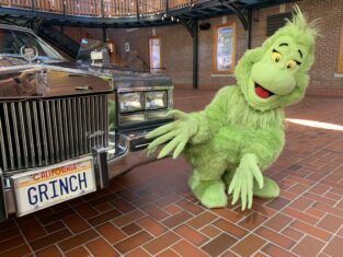 Gray Cadillac With "Grinch" License Plate