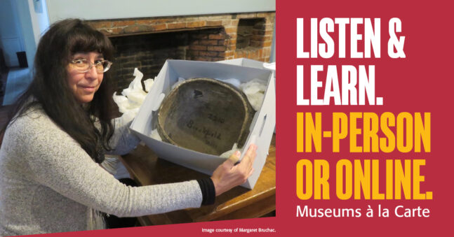 Woman seated a desk presenting a steatite bowl in a white box