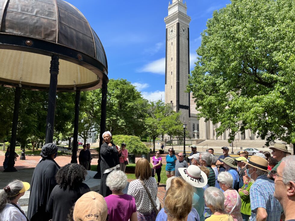 Woman speaks to a crowd