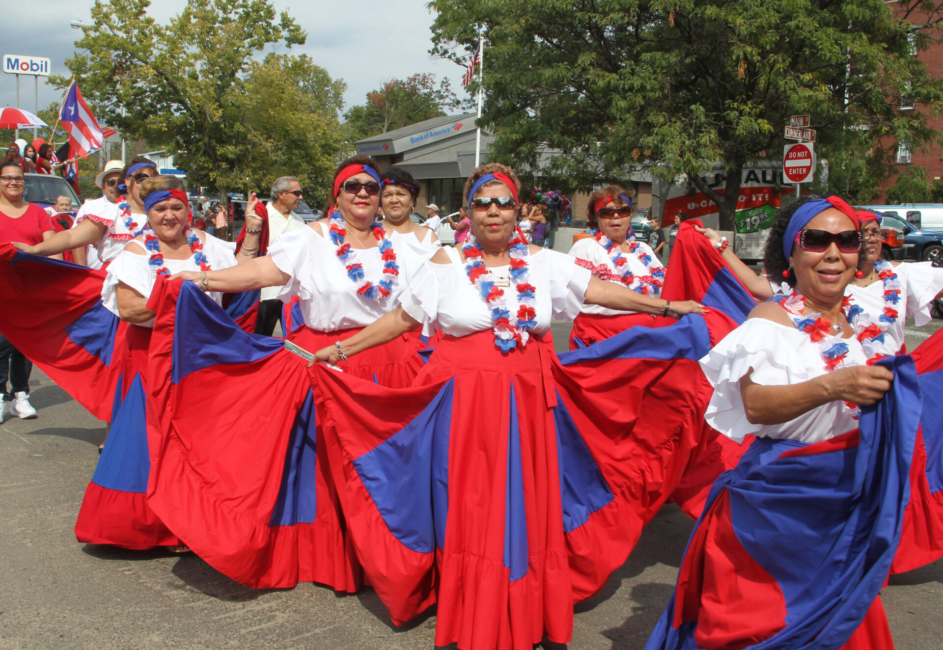Women march in the Springfield Puerto Rican Pride Parade