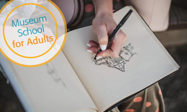 Woman sketching in notebook