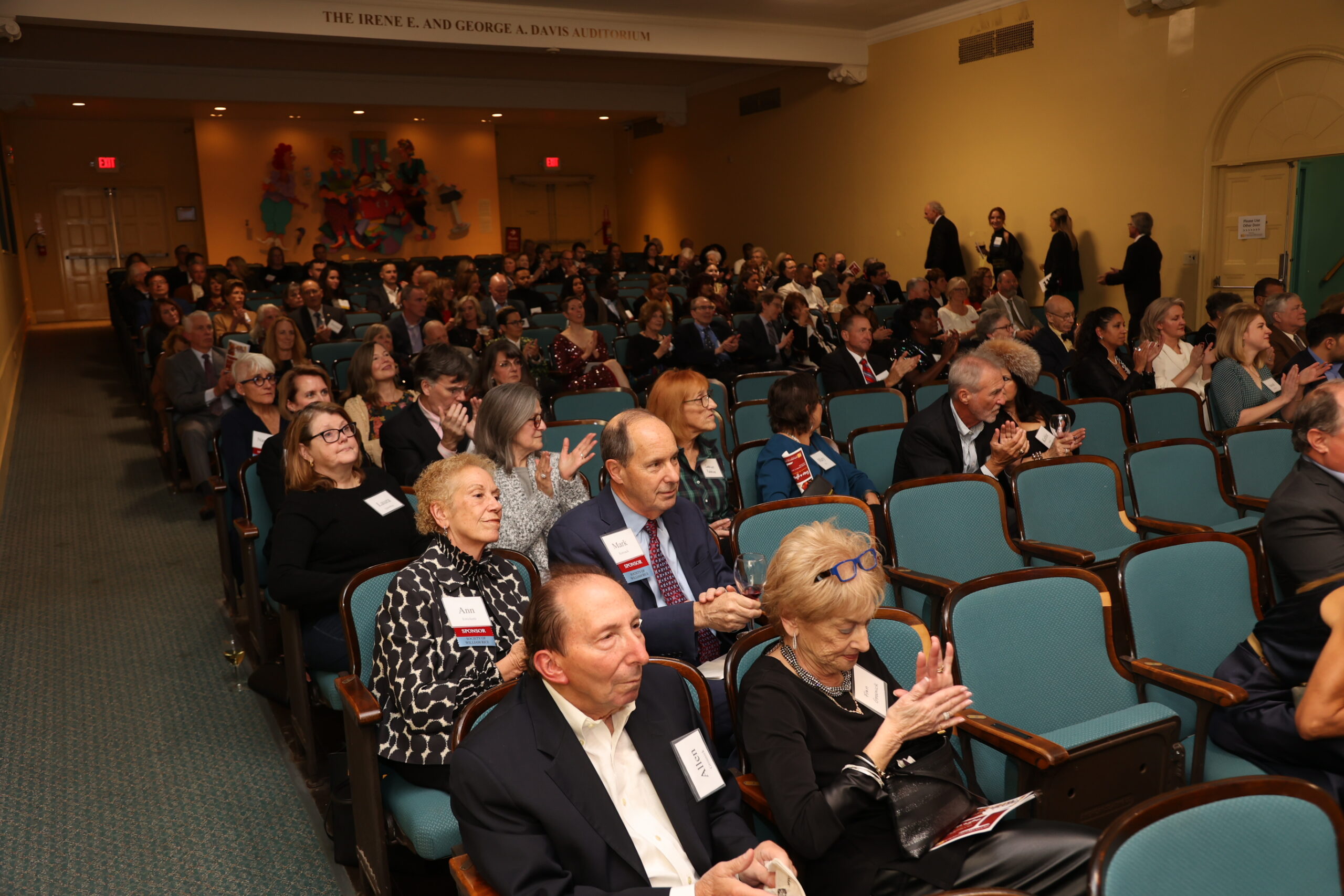 Crowd of people sitting in an auditorium