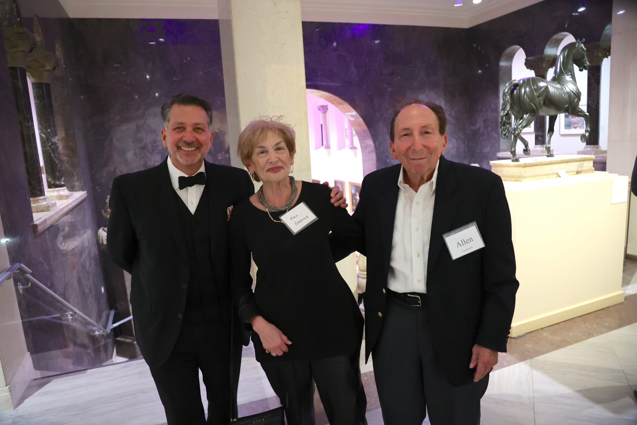 Three people, including Wine Sommelier Anthony Giglio, smiling for the camera