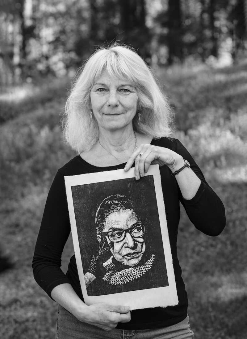 Julie Rivera holding her Ruth Bader Ginsburg print