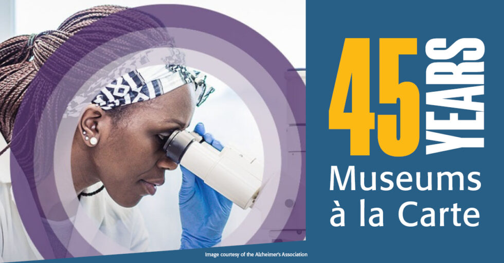 Woman looking through a microscope