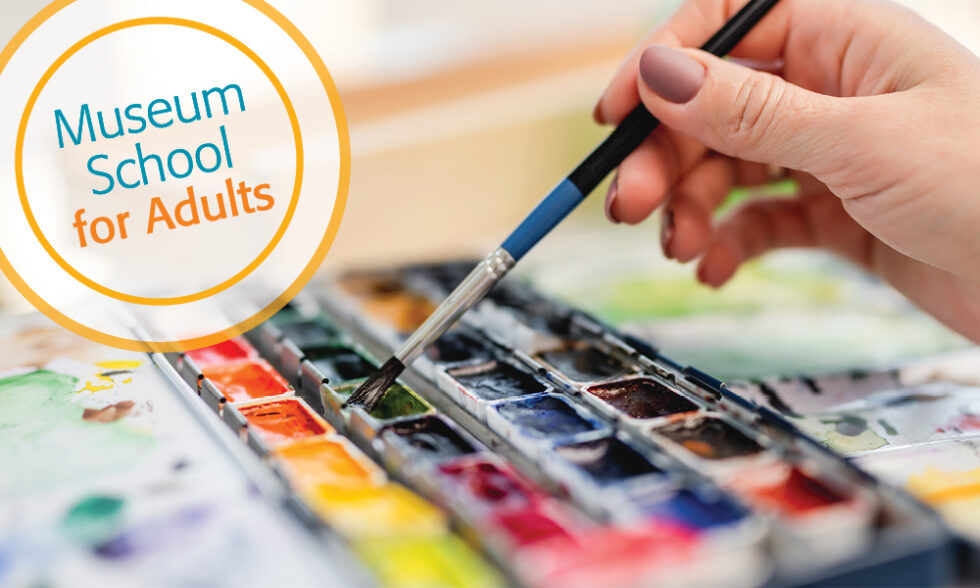 Hand of artist holding paintbrush and choosing color of watercolor