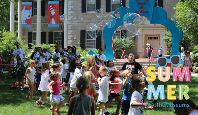 Kids chasing giant bubbles