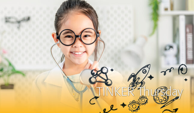 Girl dressed in a lab coat wearing a stethoscope