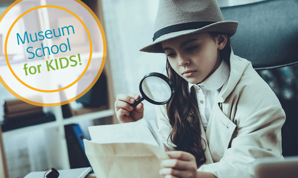 Girl looking at papers with magnifying glass