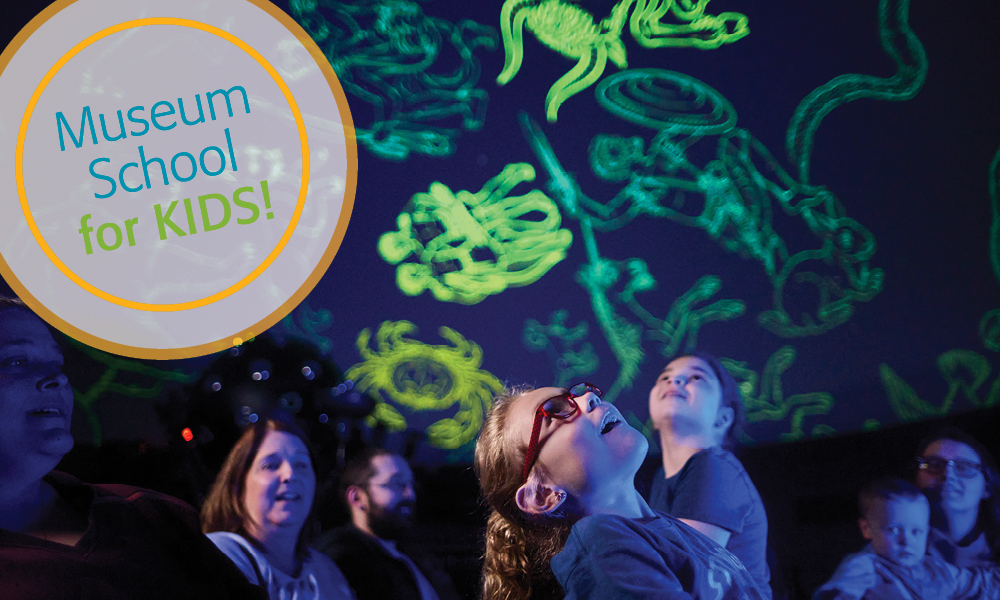 kids watching a planetarium show