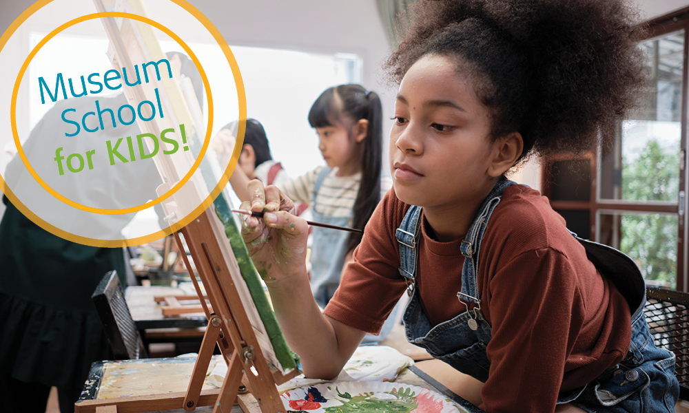 Girl concentrates on painting on canvas with other students in he background