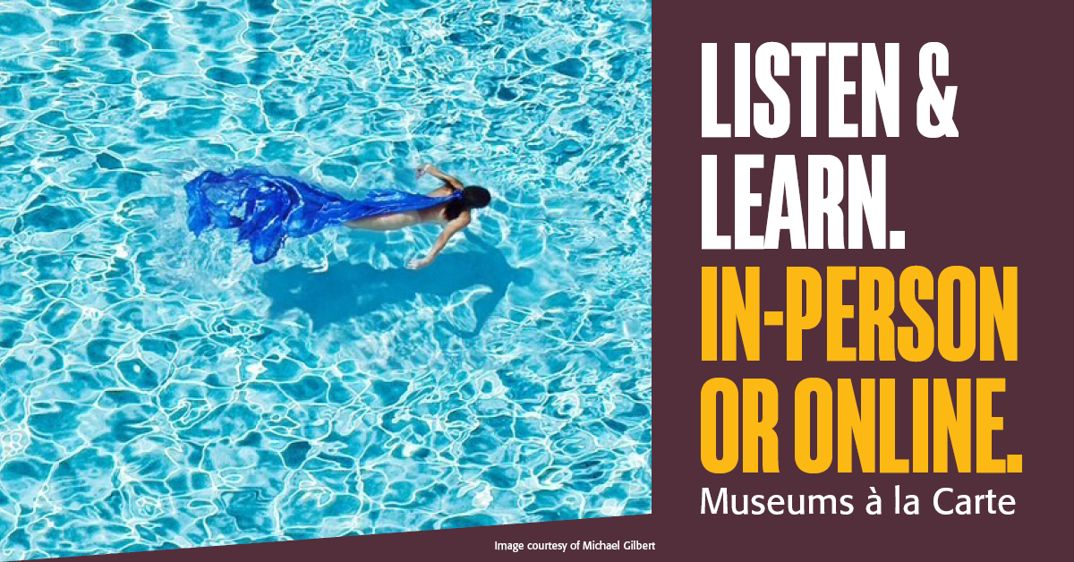 Overhead view of a woman swimming in a pool wearing a long blue dress