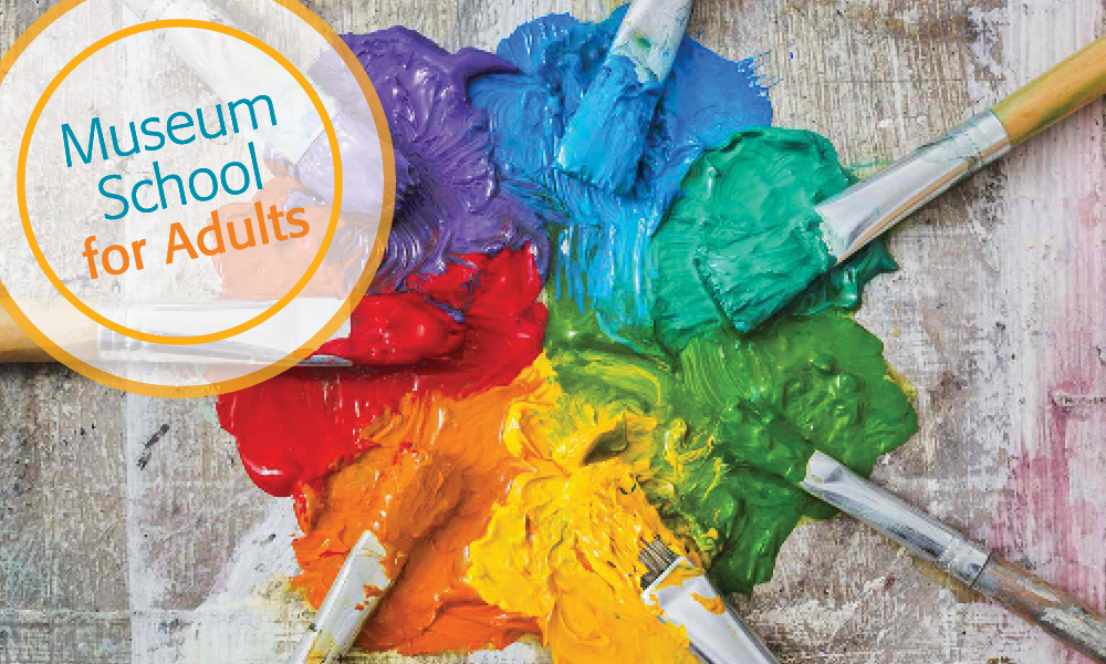 Paint brushes arranged in a circle with rainbow paints.