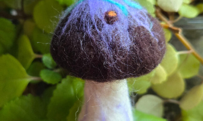 Purple mushroom ornament made from felt