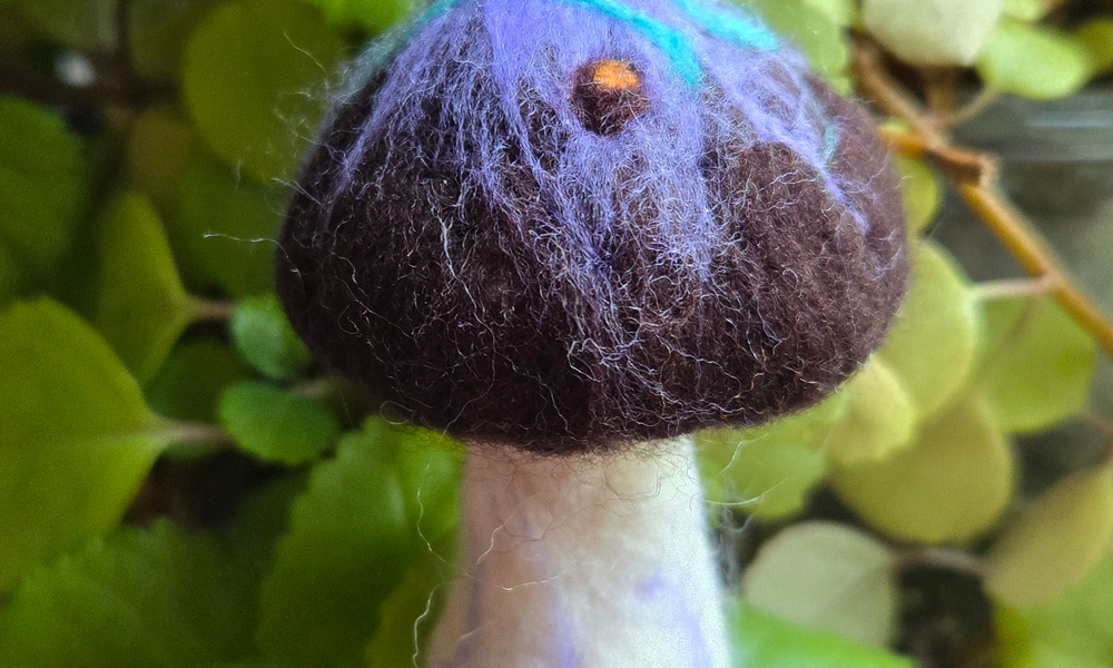 Purple mushroom ornament made from felt
